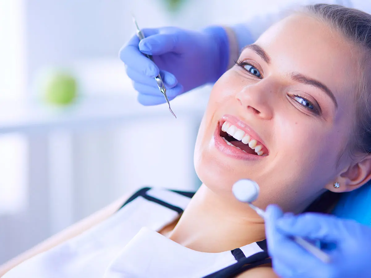 Smiling Woman After A Dental Implant Procedure In Bethpage Smiles