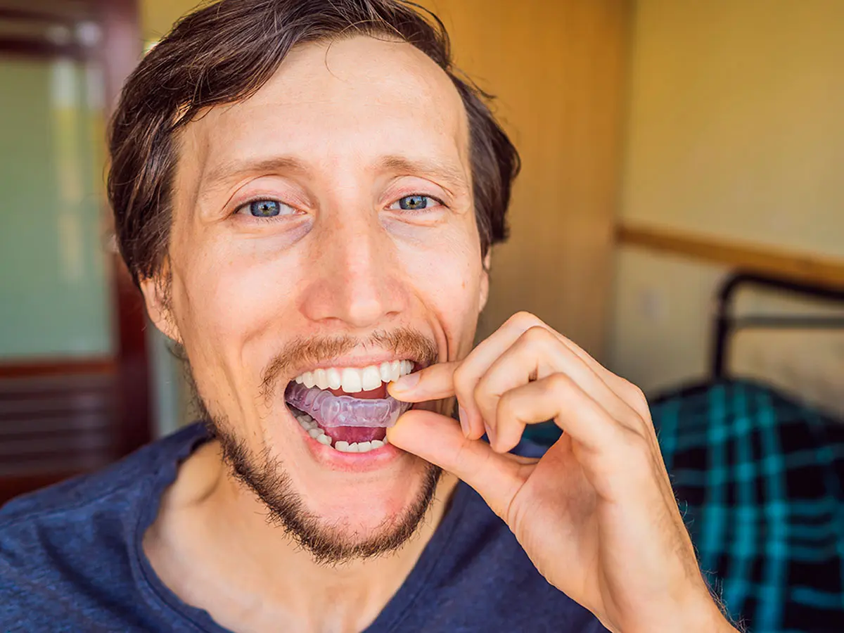 Man Wearing A Mouthguard From Bethpage Smiles